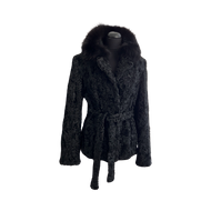 Black astrakhan fur jacket with a black Bluefox collar, featuring front pockets and fur hooks fastening, displayed on a mannequin.