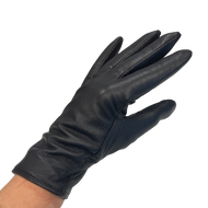 A single black leather glove on a human hand, designed for women.
