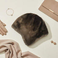 Vilniaus Kailiai Mod. K16655XX hat in soft fabric, shown in a close-up image highlighting its stylish design and craftsmanship.