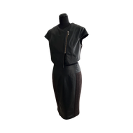 Black color midi length sheep leather skirt with a stretch wool layer, featuring a pencil silhouette, kick pleat, and an invisible zipper at the back.