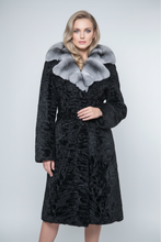 Įkelti nuotrauką į galerijos peržiūros programą, A long black textured fur coat with a wide light gray and white fur collar, displayed on a black mannequin against a light gray studio background.
