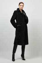 Įkelti nuotrauką į galerijos peržiūros programą, A long black textured faux fur coat with a wide collar and long sleeves, displayed on a black mannequin against a light gray background.
