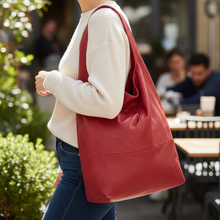 Load image into Gallery viewer, Woman holding a red bag in an outdoor setting
