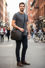 Load image into Gallery viewer, Black leather men's handbag by Vilniaus Kailiai, model 7-185A, featuring sleek design and sturdy handles.
