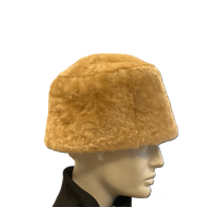Light brown sheepskin fur cap displayed on a mannequin head.