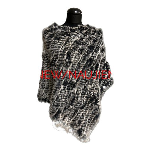 Knitted shawl on a mannequin with 'NEW/NAUJIENA' text in red on a black background