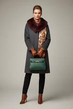 Įkelti nuotrauką į galerijos peržiūros programą, A styled flat-lay featuring a deep burgundy faux fur collar, a cream and brown patterned silk scarf, a dark green leather handbag, and a pair of brown leather gloves, arranged with autumn leaves, acorns, and berries on a light beige fabric background.
