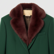 Įkelti nuotrauką į galerijos peržiūros programą, A dark green wool blazer with a luxurious dark brown fur collar, featuring a single gold button and two front flap pockets, displayed on a hanger against a light gray background.
