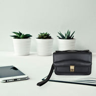 Vilniaus Kailiai Mod. 3-841 handbag showing a stylish leather bag with a sleek design and top handle on a plain background.