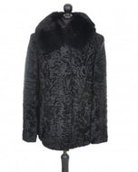 Black astrakhan fur jacket with a mandarin collar and front pockets, displayed on a mannequin.