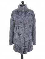 A light grey astrakhan coat with a stand violet mink collar, featuring front pockets and fur hooks fastening, displayed on a mannequin.