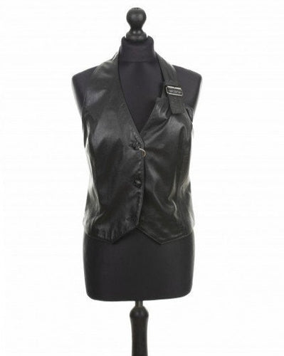 Black sheep leather vest with a fitted silhouette, front buttons, and an adjustable strap around the neck, displayed on a mannequin.