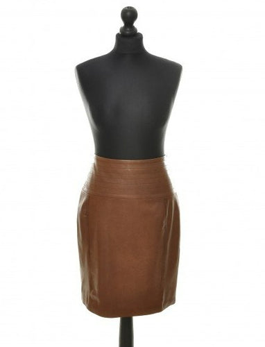 A brown leather midi-length skirt displayed on a mannequin, with a fitted silhouette and a quilted top.