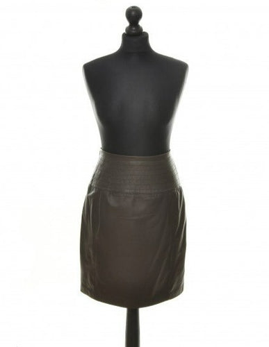 A brown leather midi skirt with decorative stitchings, displayed on a mannequin.