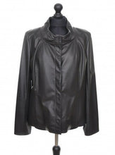 Load image into Gallery viewer, Black short sheep leather jacket with press-studs opening and lining, wide stand collar and pockets at the front, displayed on a mannequin.
