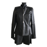 A black short sheep leather jacket with suede details, featuring a stand collar, zipper opening, and front pockets.