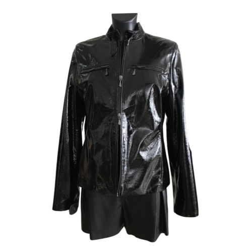 A black short patent leather jacket with a stand collar, zipper opening, and lining, displayed on a mannequin.