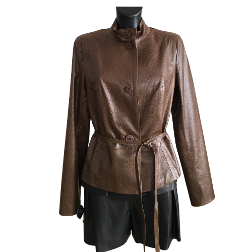 A brown sheep leather belted short jacket with buttons, displayed on a mannequin wearing a dark outfit.