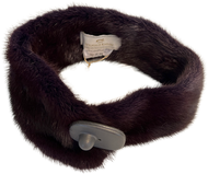 A short mink scarf with a magnetic press-stud fastening, displayed in a curved shape emphasizing the plush fur texture.